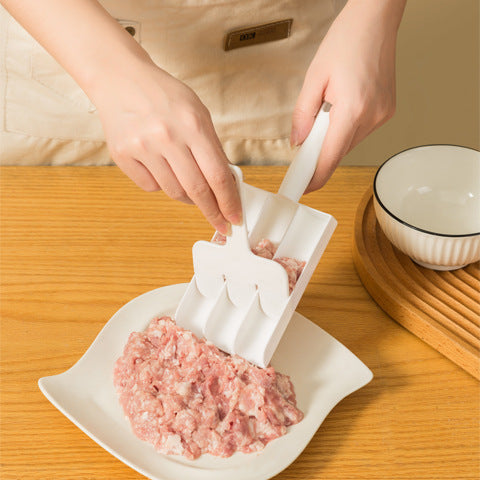 Outil à confection de boulettes
